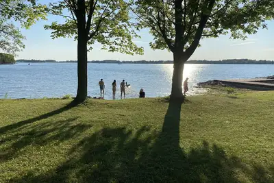 Waterfront, sunlit cozy cottage with large dock, fire pit and good swimming.