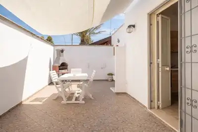 Image de Appartement 'Oasi Del Conte' avec terrasse privée et climatisation