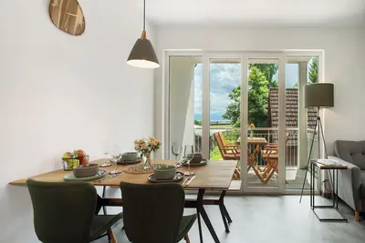 Image de Appartement de vacances \"Waldruhe Hof Schütterle\" avec vue sur le lac, jardin partagé et Wi-Fi