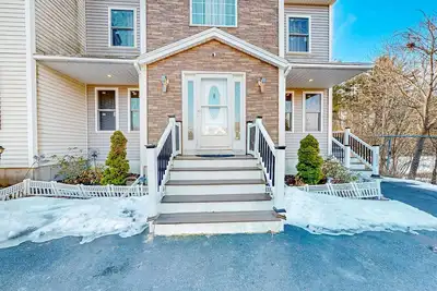 Stylish condo with a high-end kitchen, washer\/dryer, & large yard