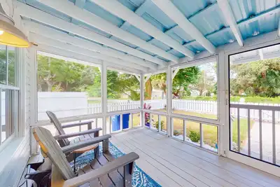 Riverfront dog-friendly cottages with kayaks, dock, patio, grill, & water views