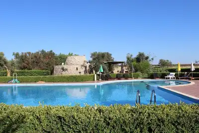 Image de A 5 Minuti dal Mare di Rivabella, Tipico Trullo con Piscina, Tenuta Girasole