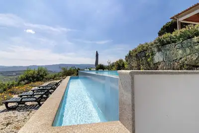 Image de Maison de vacances 'Casa Cerdeirinhas De Basto' avec vue sur la montagne, piscine privée et Wi-Fi