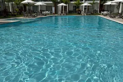 Cozy vacation home away from home. Enjoy the pool from your door step. \n