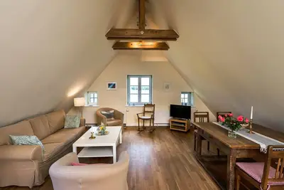 Image de Appartement de vacances \"Gut Grubnow Rügen - 8\" avec vue sur le lac, jardin partagé et Wi-Fi
