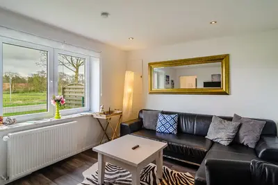 Image de Maison de vacances 'Krummes Häusschen An Der Nordsee' avec terrasse et jardin