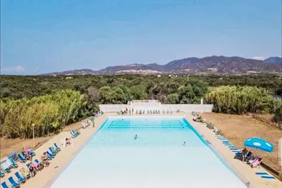 Image de Joli appartement avec piscine, climatisation, Wifi, Tv, terrasse, animaux admis et parking