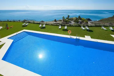 Image de Confortable appartement avec piscine, Wifi, climatisation, Tv, terrasse, animaux admis et parking