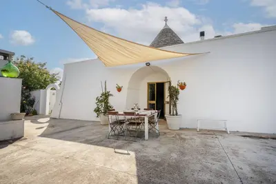 Image de Appartement 'Trullo' avec piscine partagée, terrasse privée et Wi-Fi