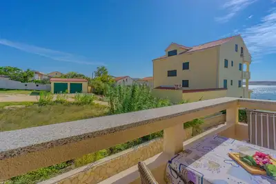 Image de Studio-Apartment with sea view, directly at the beach, beach chairs