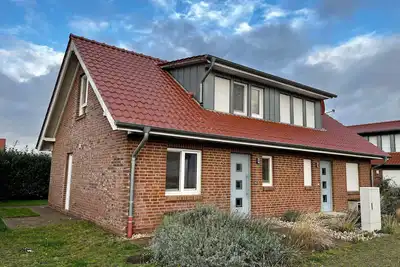 Image de Maison de vacances 'Haus Strandräuber Mit Sauna' avec terrasse privée, jardin privé et Wi-Fi