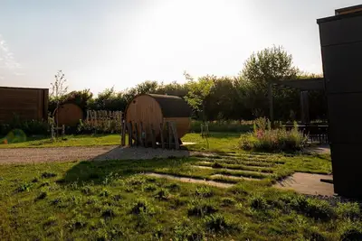 Image de Holiday Villa Amalia 4 Deluxe is a 4-person holiday villa and features a private sauna. The home has two bedrooms and is situated on a generous and beautifully located plot surrounded by nature.