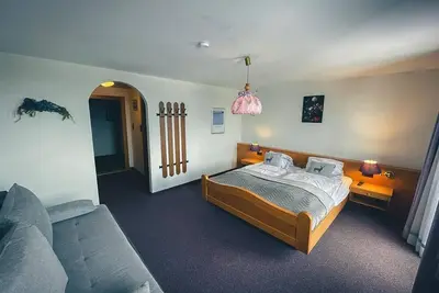 Image de Four-bed room 2, sofa, bath/Wc, south-facing balcony - Hotel-Gasthof Lammersdorf