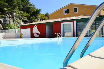 Image de Confortable appartement avec piscine, climatisation, Wifi, Tv, terrasse, animaux admis et parking