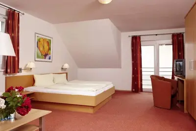 Image de Familienzimmer \"groĂźglockner Superior\" mit FrĂĽhst. - Hotel zur Post 3superior - Ihr Familienhotel