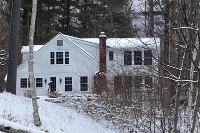 Picturesque creekside home with gorgeous deck & sunroom, near 4 ski mountains