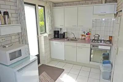 Image de Type Strandparel located at the Schoneveld holiday park is a cosy semi-detached house with enclosed garden and terrace on holiday park Schoneveld.