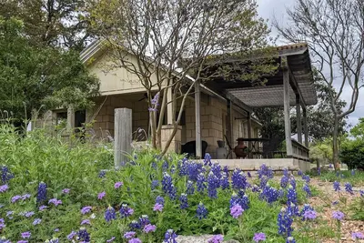 Image de Beautiful and rustic stone cottage surrounded by nature.