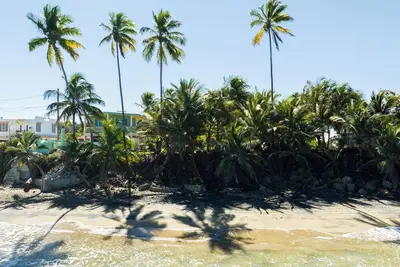 Beachfront Bliss 4-bedroom house with WiFi and Ac in Aguada