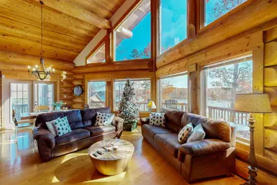 Image de Custom-built lakefront home with lake views, firepit, fireplaces, dock, & deck