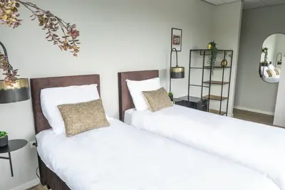 Image de Chambres combinées, 12 lits, cuisine et parking gratuit