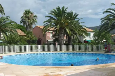 Image de Duplex 3 pièces climatisé avec piscine, terrasse et parking - Idéal famille au Lavandou