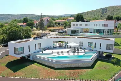 Image de Luxury Villa Red & Blue heated pool, sauna, tennis court, mini golf, stylish, family, panoramic view