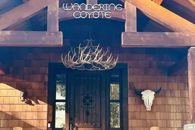 The \"Wandering Coyote\" riverfront home located on the Swan River in Bigfork, Mt.
