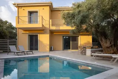 New 3-bedroom modern villa with private pool, surrounded by olive trees.