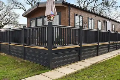 Image de Enjoy a coastal escape in a two-bedroom lodge on a holiday park near the beach.