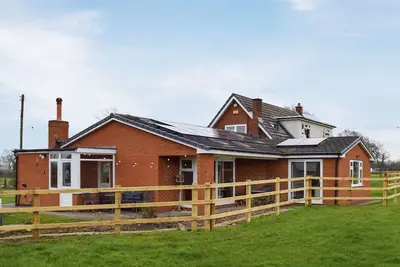 A wonderful single level property set within a working equestrian setting.