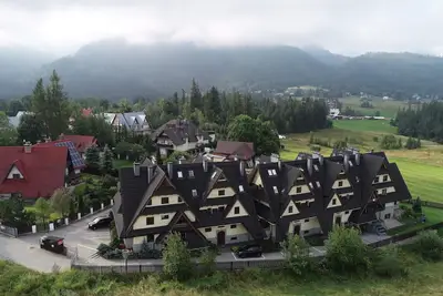 Image de Apartament z basenem, sauną i widokiem na Tatry w Kościelisku k. Zakopanego.