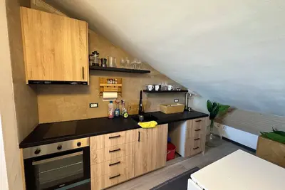 Image de Cozy penthouse in Barolo area. Renovated 2024. New kitchen, bathroom, sofa / bed