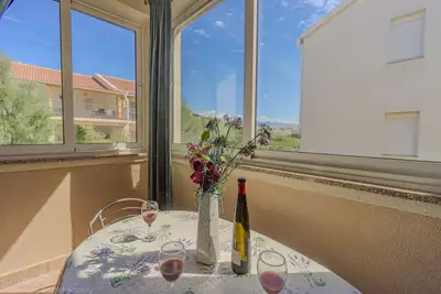 Image de Apartment directly at the beach, shared terrace on the beach with grill