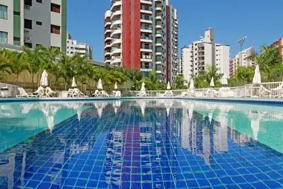 Image de Flat próximo a praia, estrutura com piscinas e academia. Wi-fi alta velocidade.