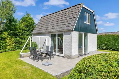 Image de Dune Bungalow directly against the dunes for 4 persons. Spacious garden, Walking in nature, Cycling, Peace and quiet.