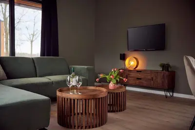 The Amalia 4 is a luxurious holiday home with a private sauna, a spacious living room, open kitchen, two bedrooms and a spacious patio.