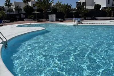 Image de Maison de vacances 'Villa Palmeras' avec vue sur la mer, piscine partagée et Wi-Fi