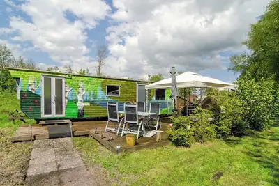 Image de Maison de vacances 'Süßes Häuschen Am See' avec terrasse privée et jardin privé