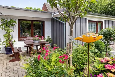 Image de Maison de vacances 'Ferienwohnung Carstens' avec terrasse privée, jardin privé et Wi-Fi