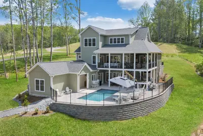 Image de Whispering Pines Estate, Waterfront Luxury w/ Covered Verandas + Heated Salt Pool, Hot Tub, Dock!