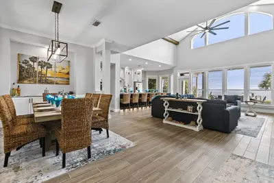 Image de Spacious riverfront home perfect for larger families, featuring stunning river views, private dock