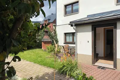Image de Gemütliche Ferienwohnung Über 2 Etagen mit Garten und Kamin, Haustierfreundlich!