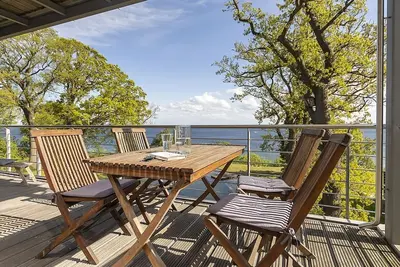 Image de Villa Nause Og5 - Meerblick, Sauna, Kamin - Ferienwohnung - Og5