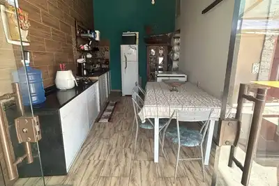 Image de Casa com 3 Suites e com Cozinha e Quintal com Churrasqueira e Piscina