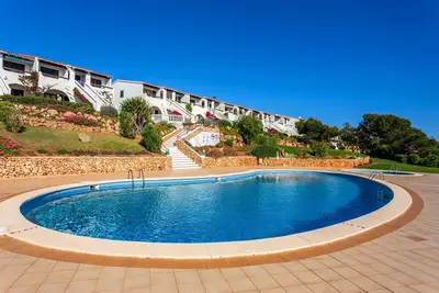 Image de Appartement 'Arenal De'n Castell' avec vue sur la mer, piscine partagée et Wi-Fi