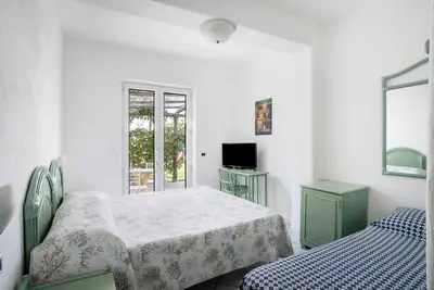 Image de Chambre 'A - Vista Giardino' avec jardin partagé, Wi-Fi et climatisation