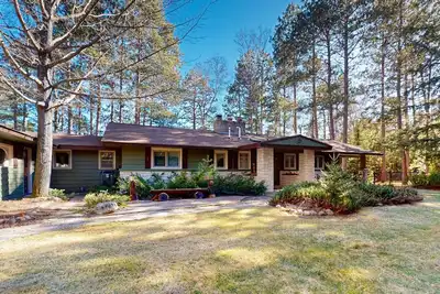 Image de Lakefront house with private covered hot tub, dock, wood fireplace, & firepit