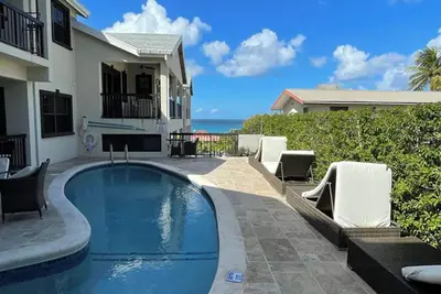Nestled in the heart of Fitts Village, Zinnia becons with the promise of a costal getaway