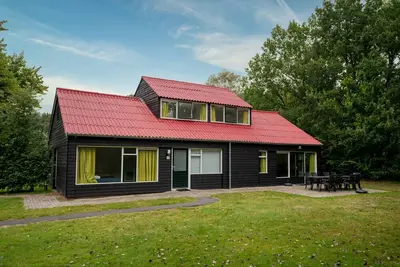 Maison confortable dans un parc de vacances arboré
